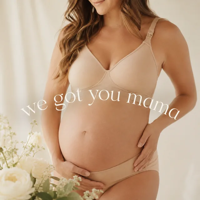 Someone in late pregnancy, hands resting on her bump